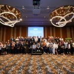 Collective snapshot of summit speakers alongside attendees at the Conversational AI & Customer Experience Summit Asia